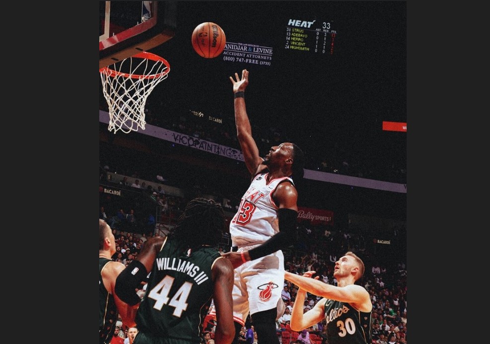 Pebasket Miami Heat Bam Adebayo melepaskan tembakan dalam laga NBA melawan Boston Celtics