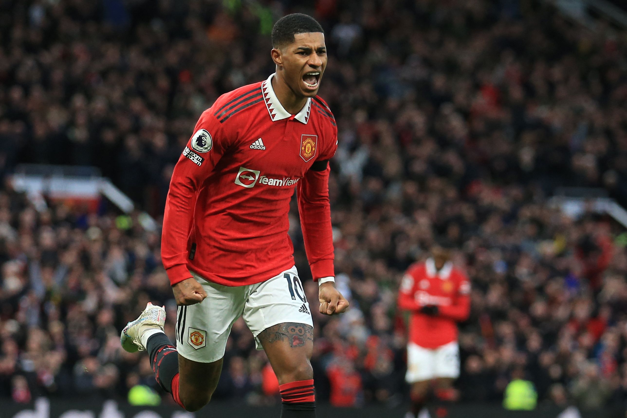 Pemain MU Marcus Rashford melakukan selebrasi gol