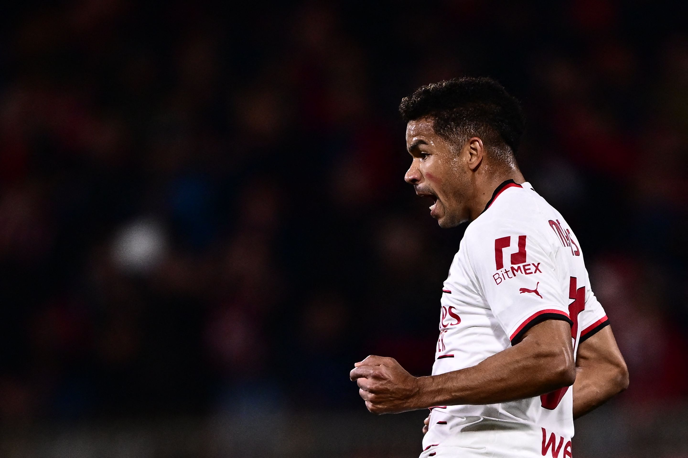 Penyerang AC Milan Junior Messias melakukan selebrasi usai menjebol gawang Monza di laga Serie A.