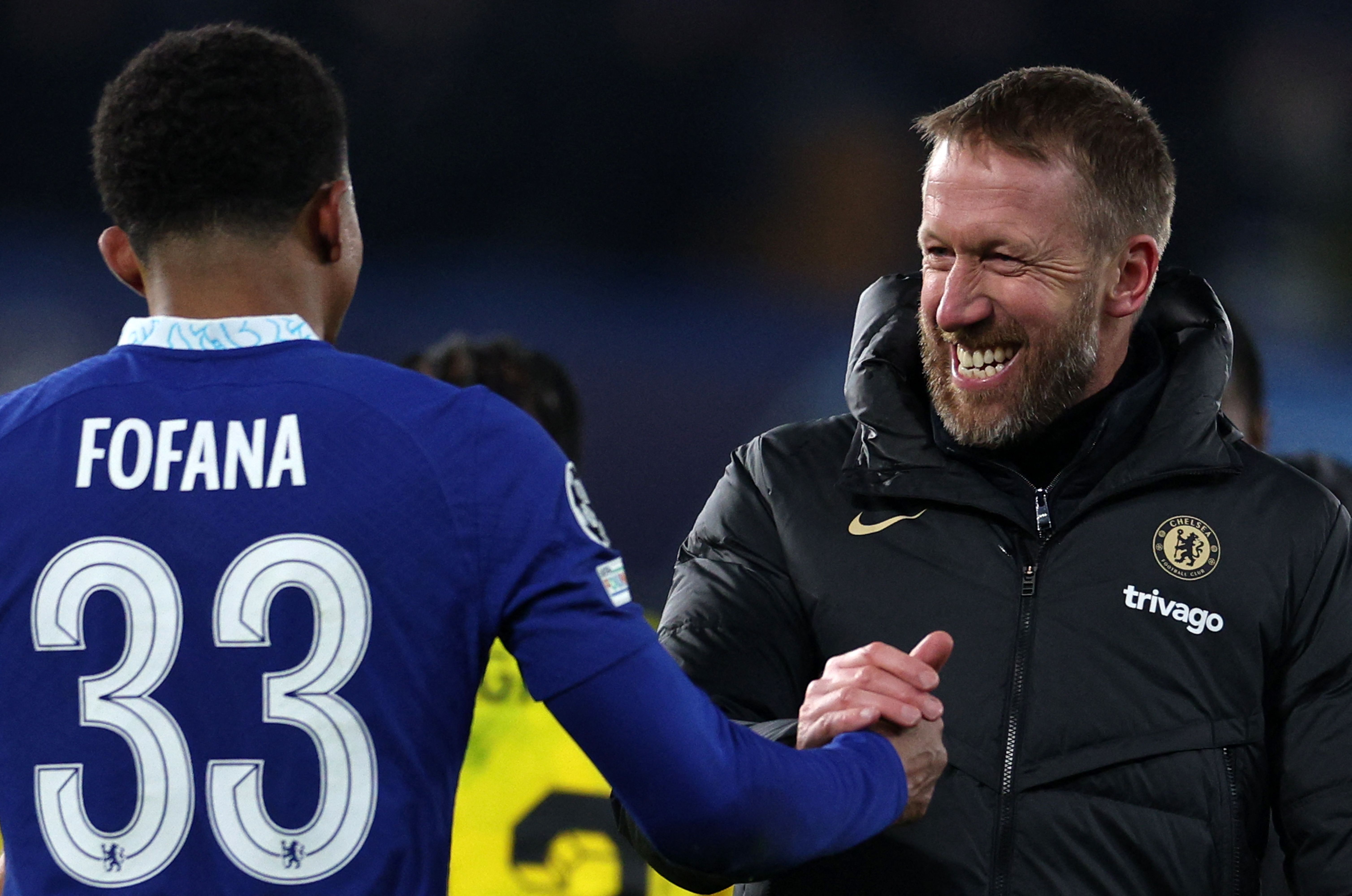 Chelsea's English head coach Graham Potter (R) celebrates with Chelsea's French defender Wesley Fofana after the UEFA Champions League 