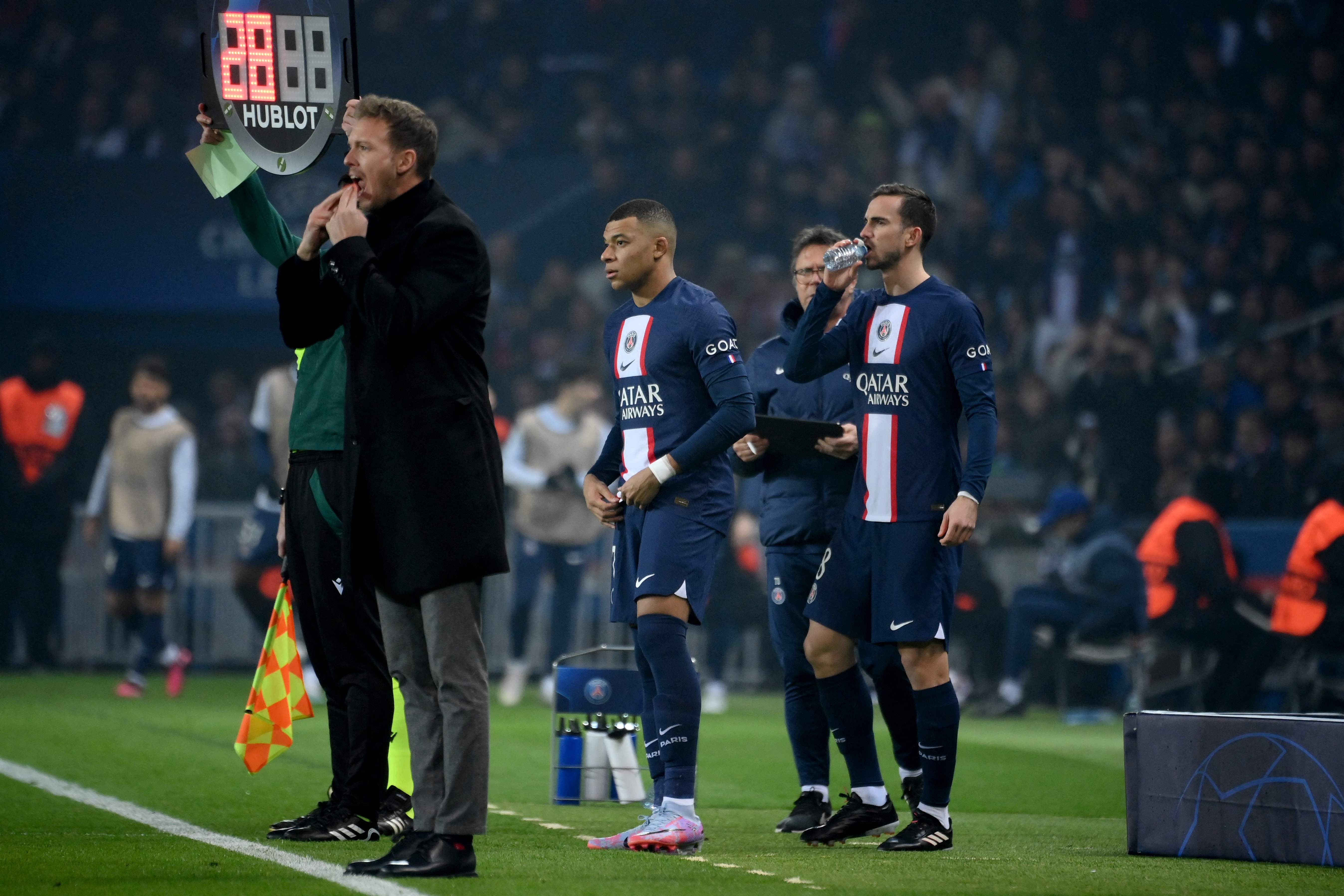 Bayern Munich's German head coach Julian Nagelsmann (L) reacts as Paris Saint-Germain's French forward Kylian Mbappe (C)
