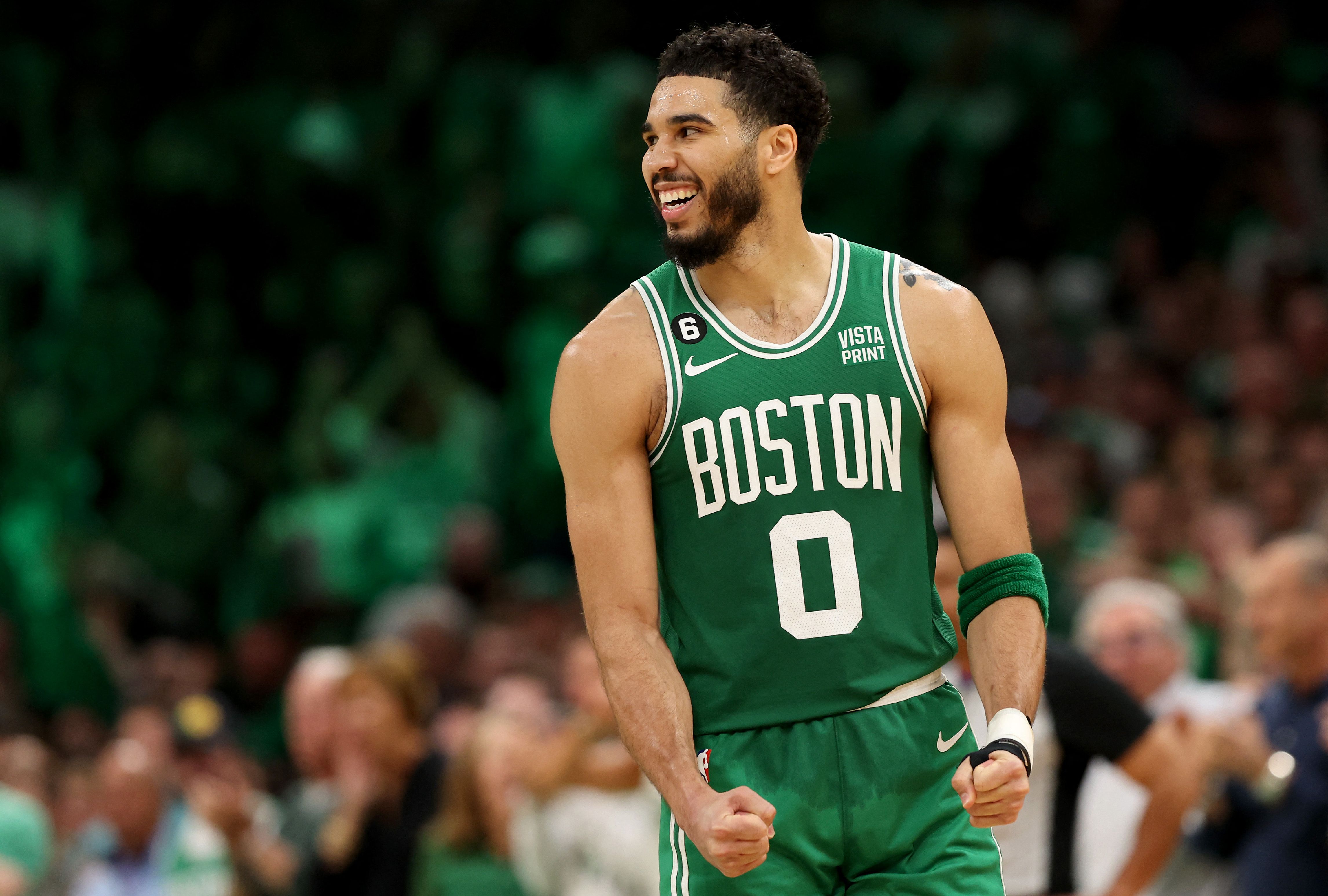 Pebasket Boston Celtics Jayson Tatum melakukan selebrasi di laga playoff NBA melawan Philadelphia 76ers.
