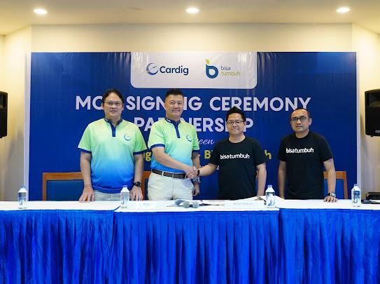 Penandatanganan kerja saja Bisatumbuh dengan Cardig.