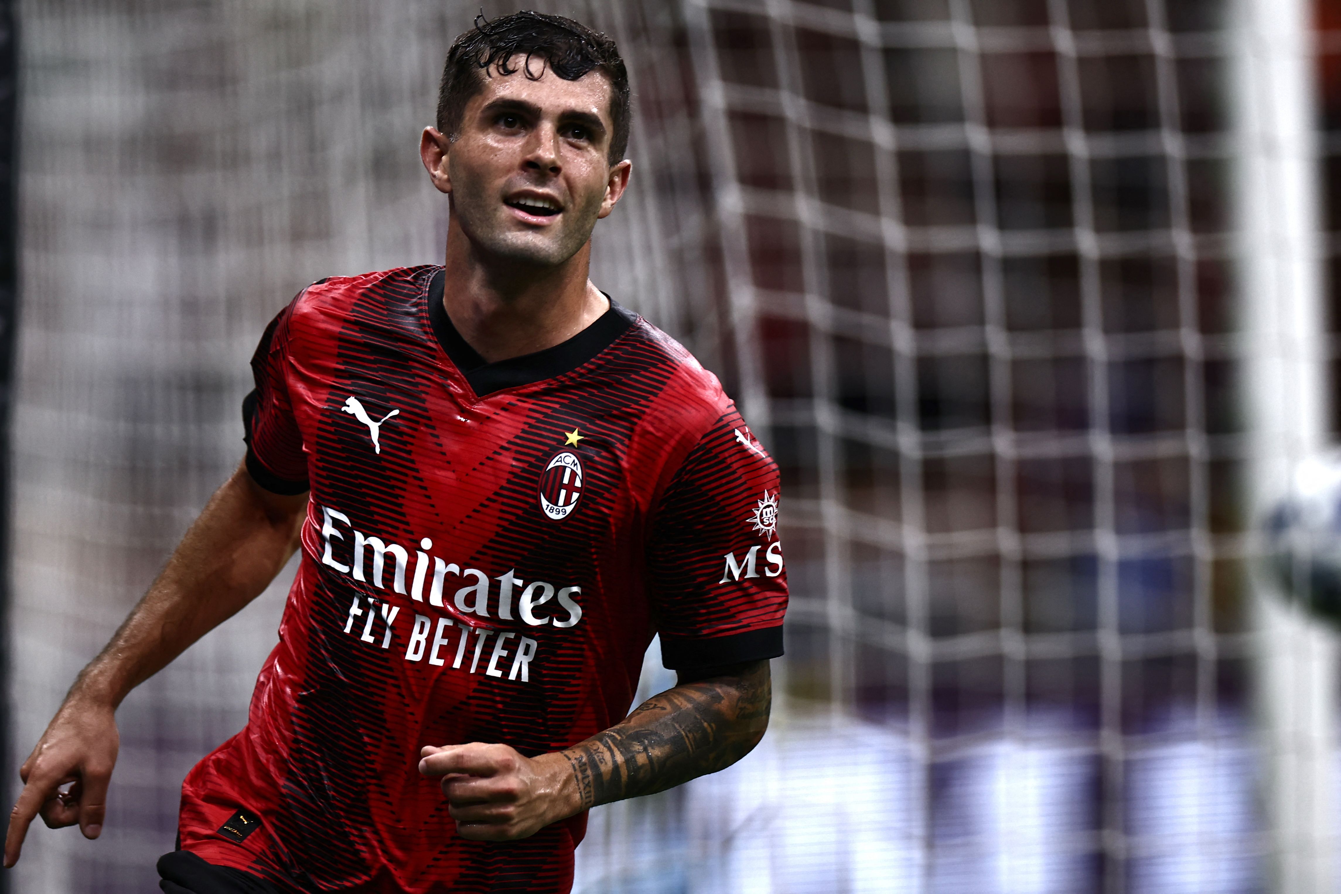 Penyerang AC Milan Cristian Pulisic melakukan selebrasi usai mencetak gol ke gawang Torino di laga Serie A.