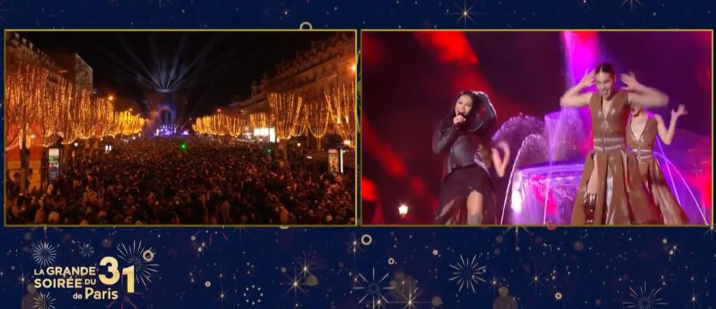 Aksi panggung Anggun saat tampil pada Malam Tahun Baru 2024 di Champs Elysees, Paris, Prancis. 