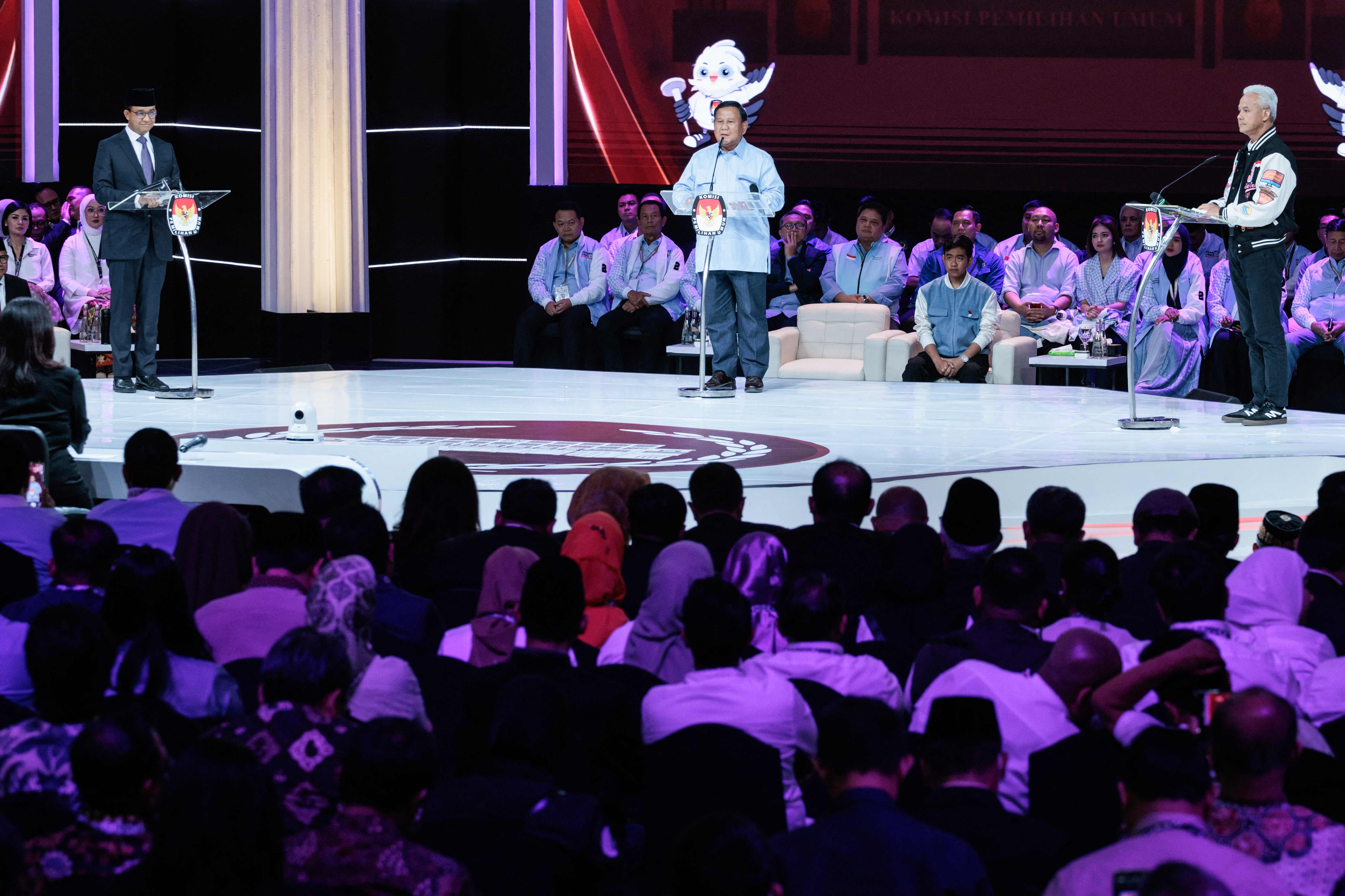 Three pesidential candidates, Anies Baswedan (L), Prabowo Subianto (C) and Ganjar Pranowo, attend the last presidential election debate at t