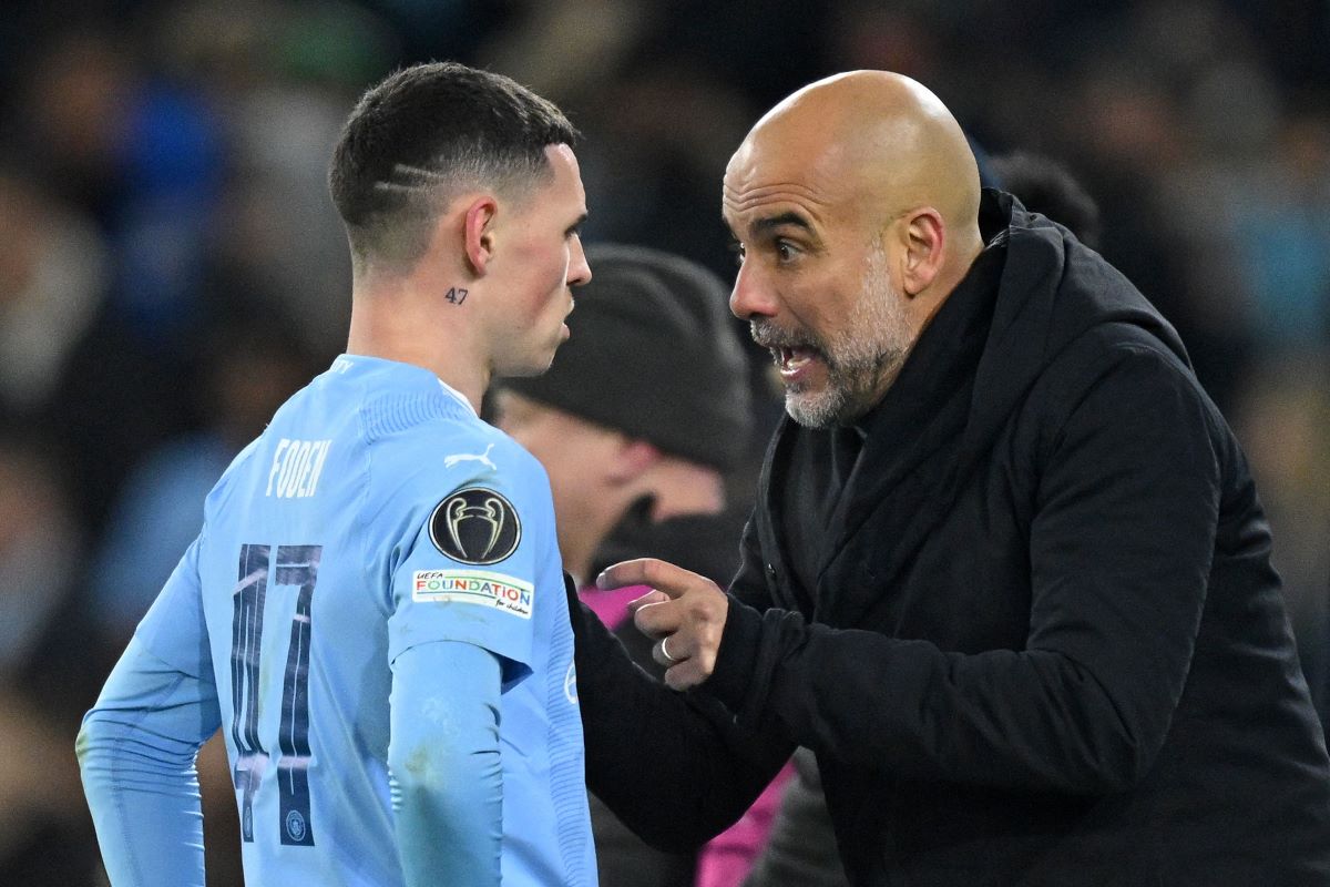Pelatih Manchester City Pep Guardiola dan striker Phil Foden
