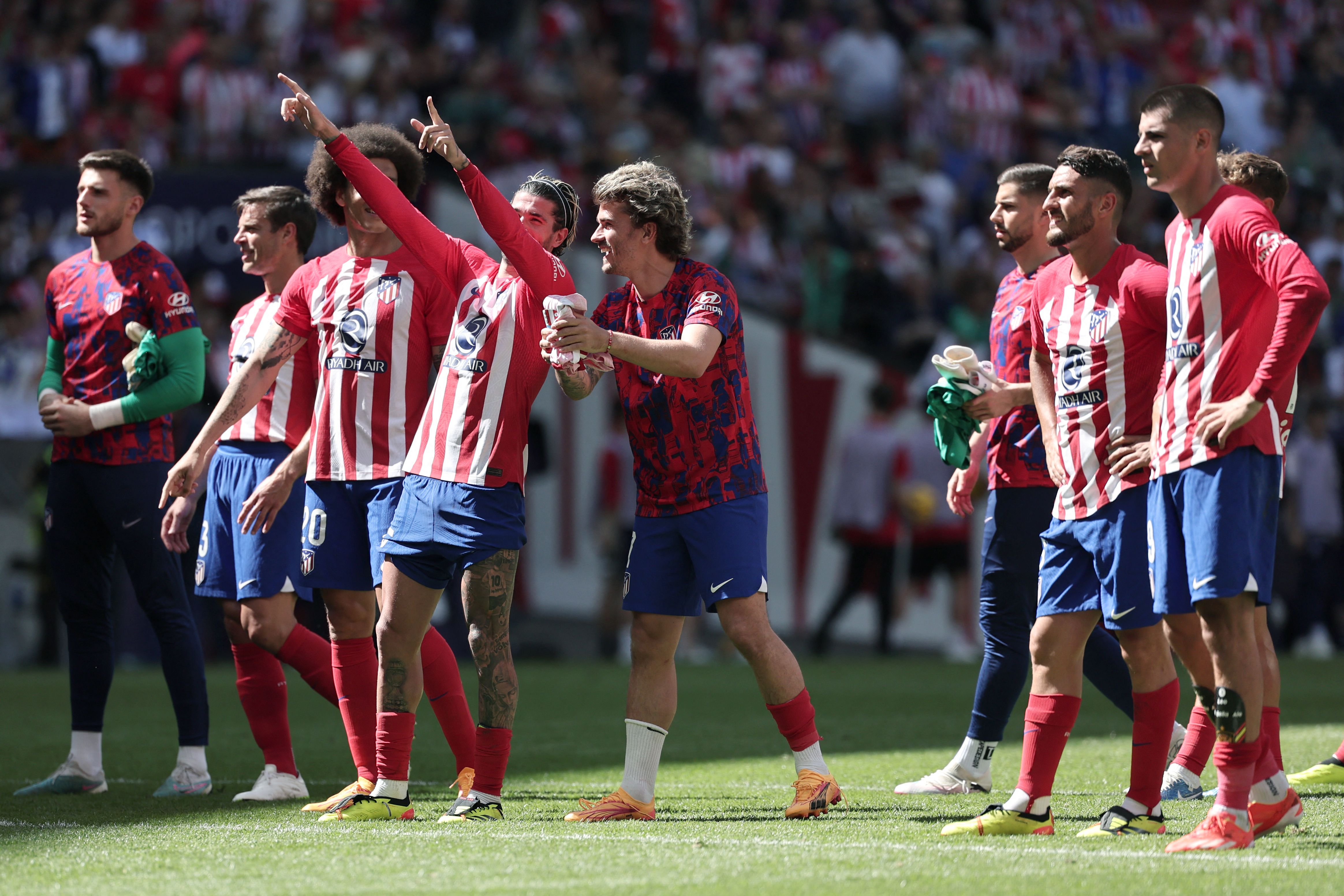 Pemain Atletico Madrid merayakan kemenangannya atas Girona