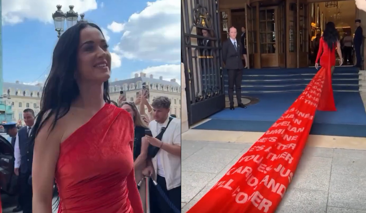 Katy Perry menarik perhatian di Paris Couture Fashion Week dengan mengenakan gaun Balenciaga berwarna merah sepanjang 200 yard