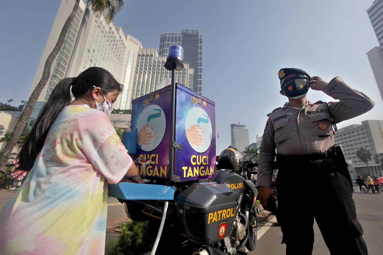 Sosialisasi Pengunaan Masker dan Cuci Tangan