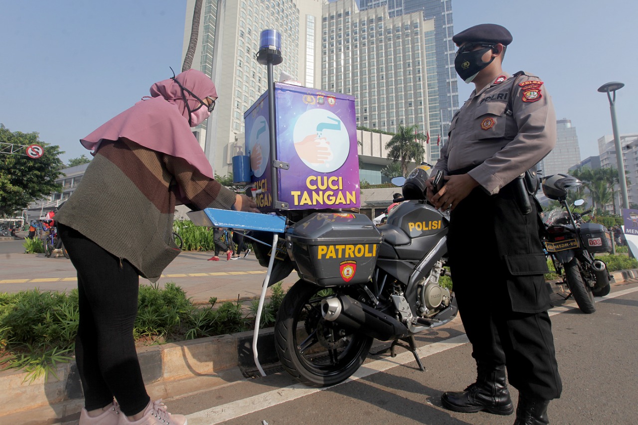 Sosialisasi Pengunaan Masker dan Cuci Tangan
