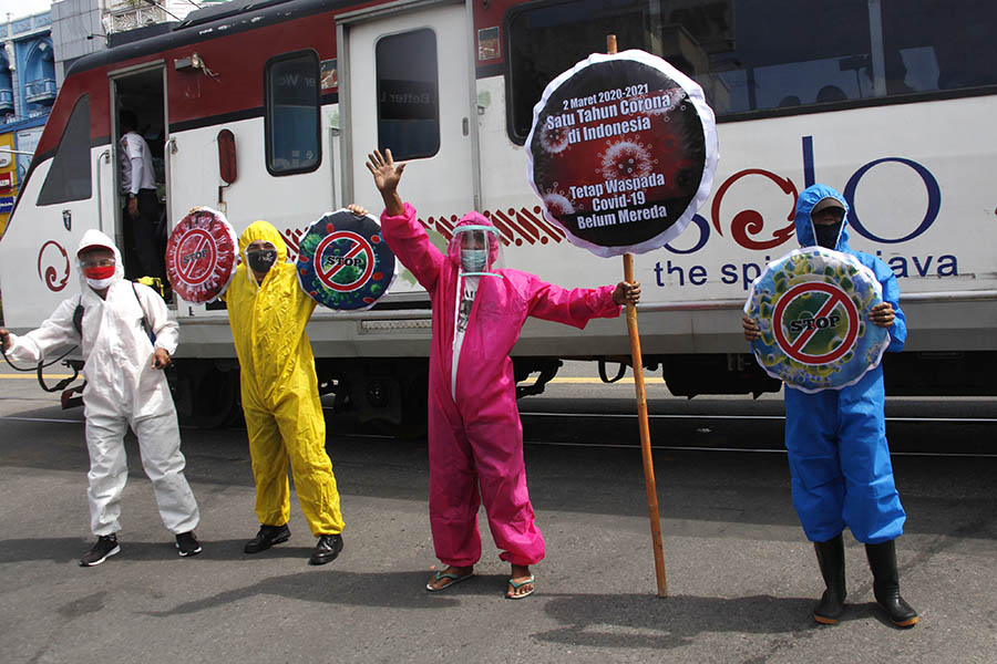 Relawan Peringati Setahun Pandemi Covid-19 di Indonesia 